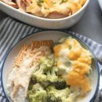 Delicious Broccoli Cheese Casserole with buttery Ritz cracker topping served in a dish.