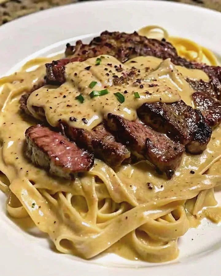 Creamy Cajun Steak Alfredo featuring tender steak in rich Alfredo sauce