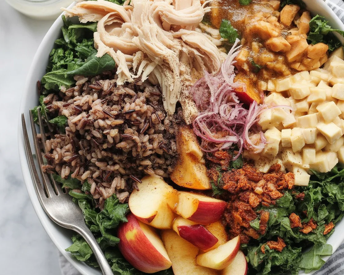 A colorful Autumn Harvest Grain Bowl with roasted veggies, grains, and maple dressing.