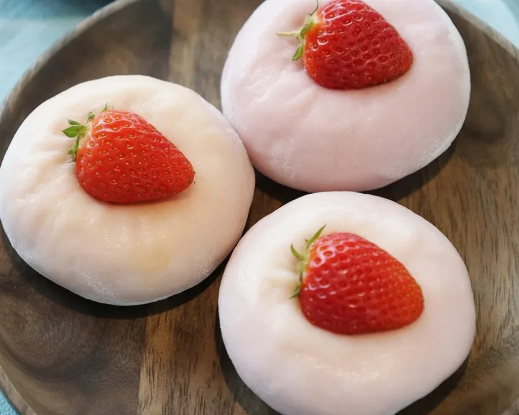 Delicious homemade strawberry mochi dessert with fresh strawberries and mochi dough.