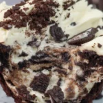 Delicious Oreo Dirt Cake with layers of crushed Oreos and creamy pudding