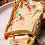 Delicious Sugar Cookie Cheesecake with a sugar cookie crust and creamy filling by Stephanie's Sweet Treats.