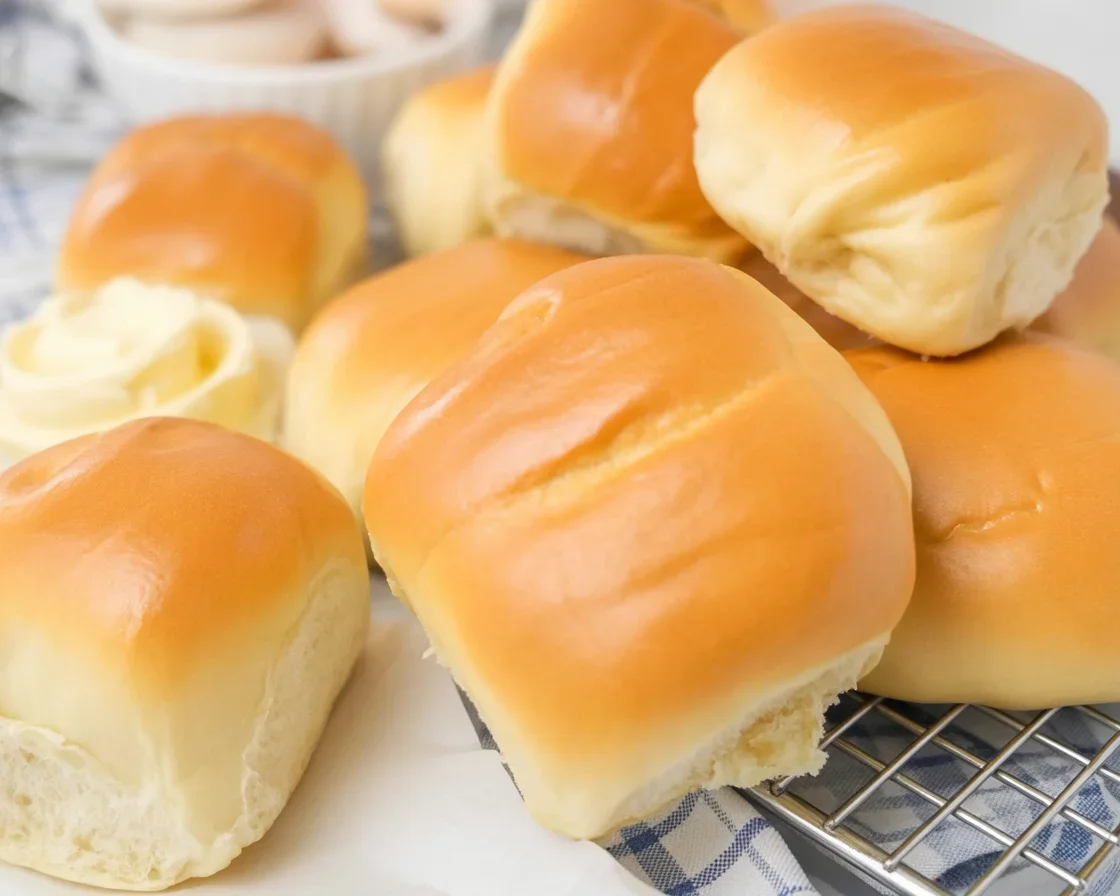 Basket of soft and fluffy Texas Roadhouse Rolls served with honey cinnamon butter.