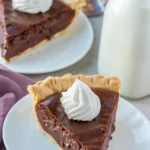 Slice of rich and creamy Old-Fashioned Chocolate Pie on a plate