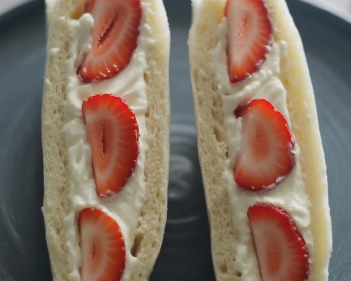 Fluffy Japanese 4-ingredient Strawberry Sando with whipped cream and fresh strawberries.