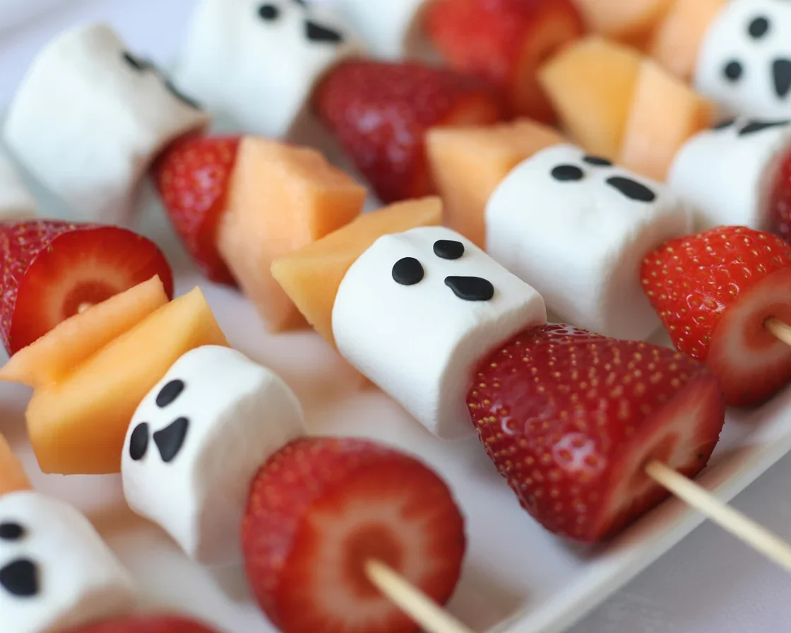 Delicious Halloween Ghost Fruit Skewers with strawberries and marshmallows