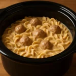 Plate of homemade Swedish meatballs with creamy sauce and lingonberry sauce