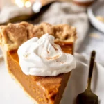 Delicious Pumpkin Pie Brûlée with Bourbon Vanilla Whipped Cream and crunchy sugar top.