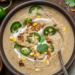 Bowl of Mexican Street Corn White Chicken Chili topped with cilantro and lime.