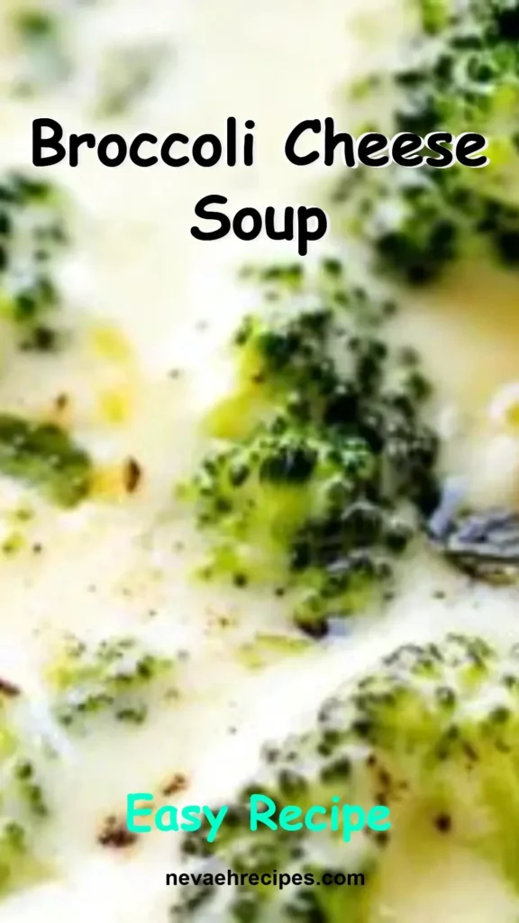 Bowl of delicious broccoli cheese soup topped with cheese and broccoli florets.