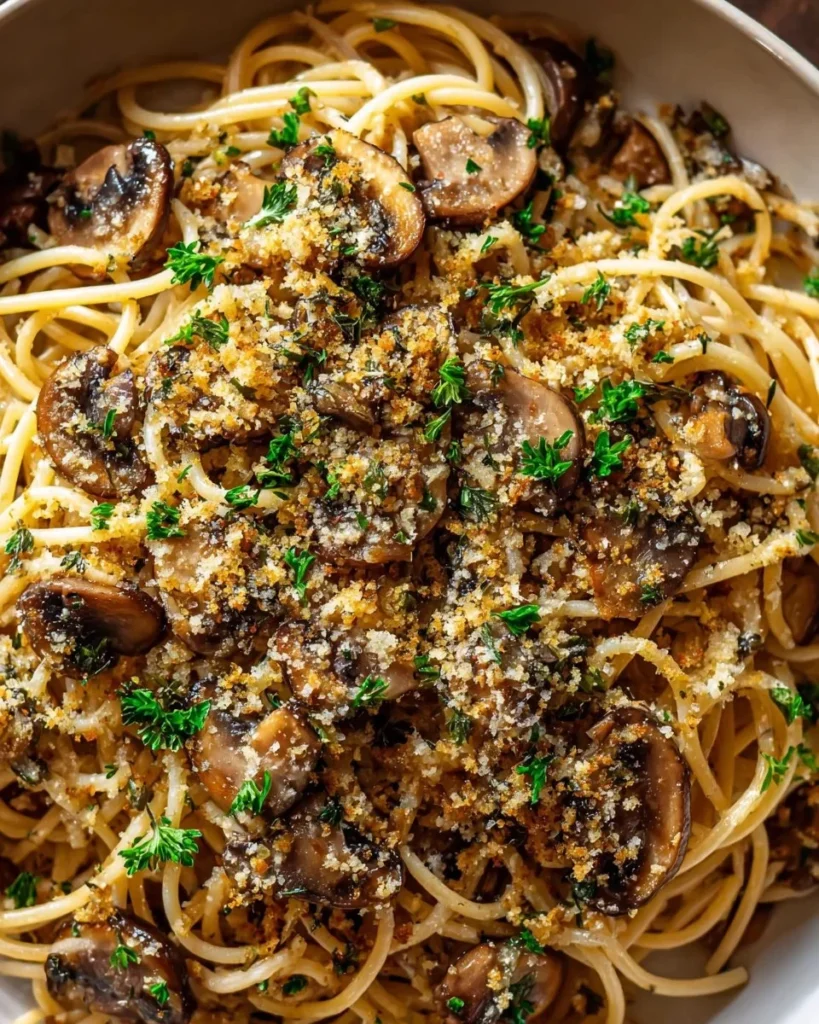 Delicious plate of Brown Butter Mushroom Pasta topped with fresh herbs
