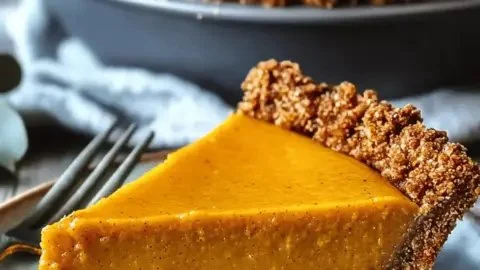 Chai Butternut Squash Pie garnished with spices and herbs
