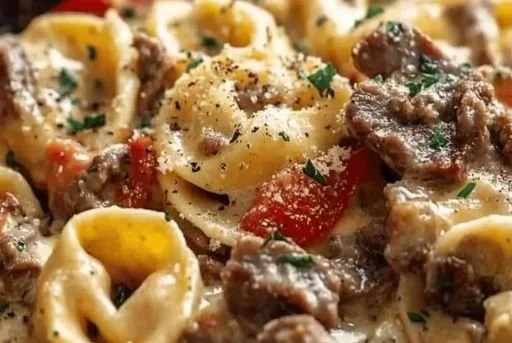 Delicious Cheesesteak Tortellini served with peppers and cheese sauce