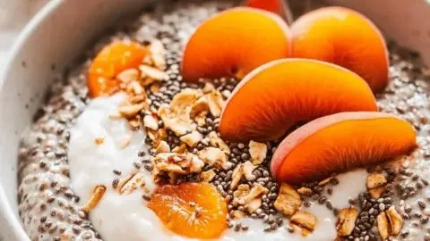 Chia seed porridge topped with dried apricots in a bowl