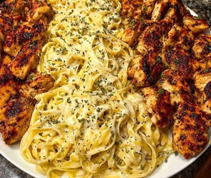 Creamy garlic butter chicken served with linguine in Alfredo sauce.