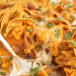 Delicious Doritos Cheesy Chicken Casserole with creamy chicken and crunchy toppings.