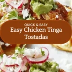 Plate of easy Chicken Tinga tostadas topped with fresh ingredients