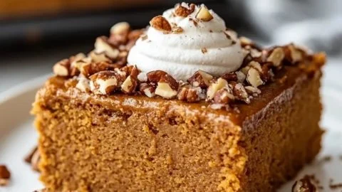 Delicious easy gluten-free pumpkin cake ready to be served at a fall gathering.