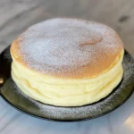 Slice of light and fluffy Japanese Cotton Cheesecake on a plate