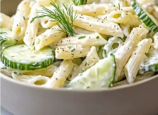 Healthy cucumber pasta salad with fresh ingredients and vibrant colors