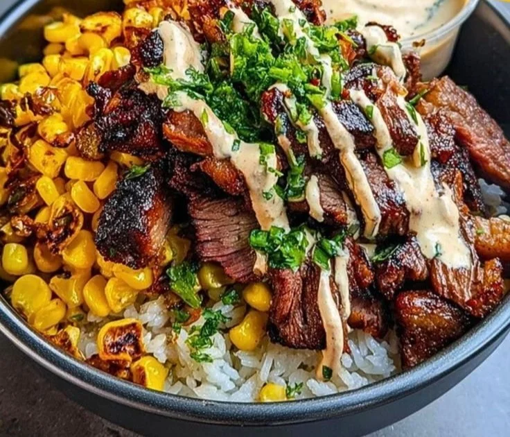 Korean BBQ Beef Bowl with corn and creamy sauce on a plate