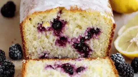 Freshly baked Lemon Blackberry Loaf with a bright and fruity appearance
