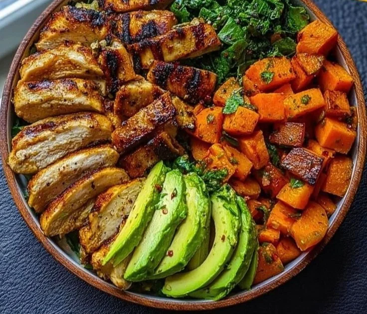 Loaded Grilled Chicken and Sweet Potato Power Bowl topped with fresh ingredients