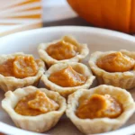 Delicious pumpkin pie bites served on a festive plate.