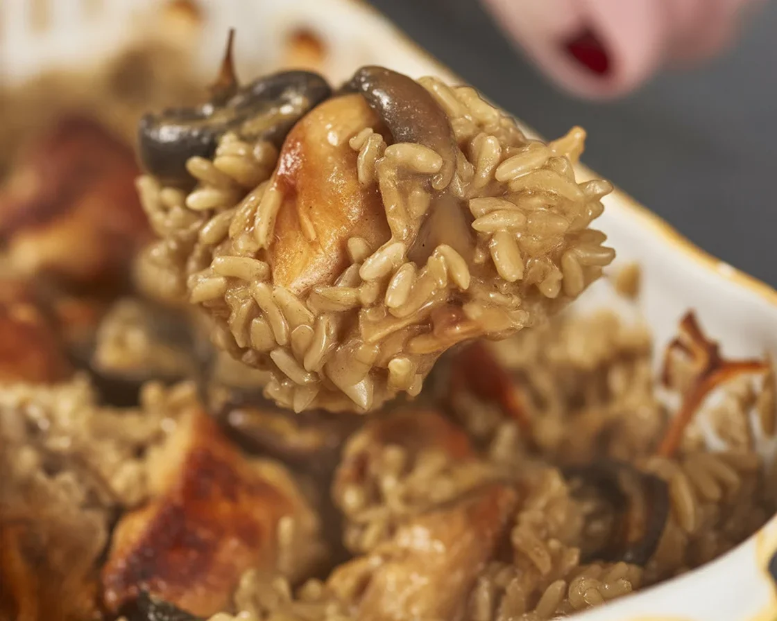 Delicious stick of butter chicken and rice casserole topped with flavorful herbs.