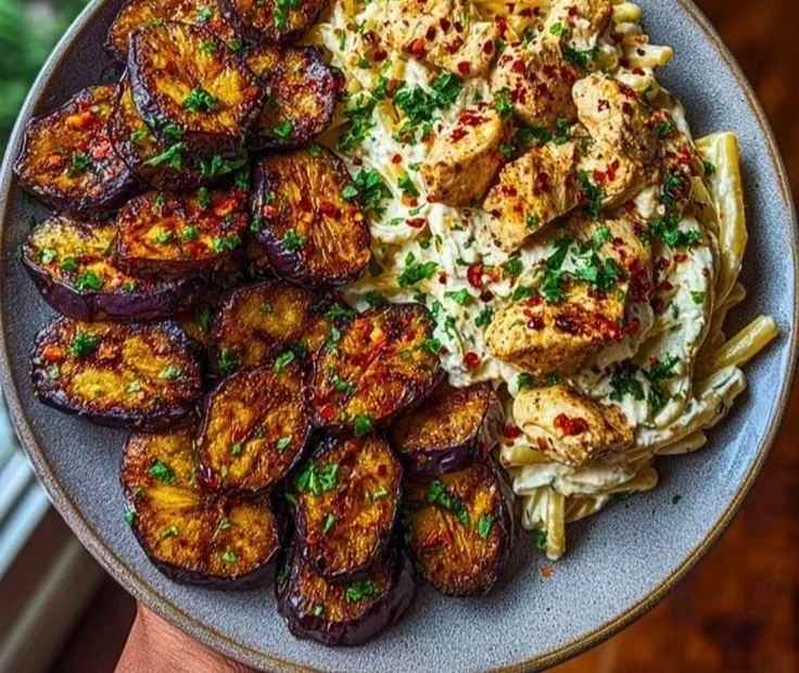 Spicy whipped feta chicken alfredo served with crispy eggplant wedges