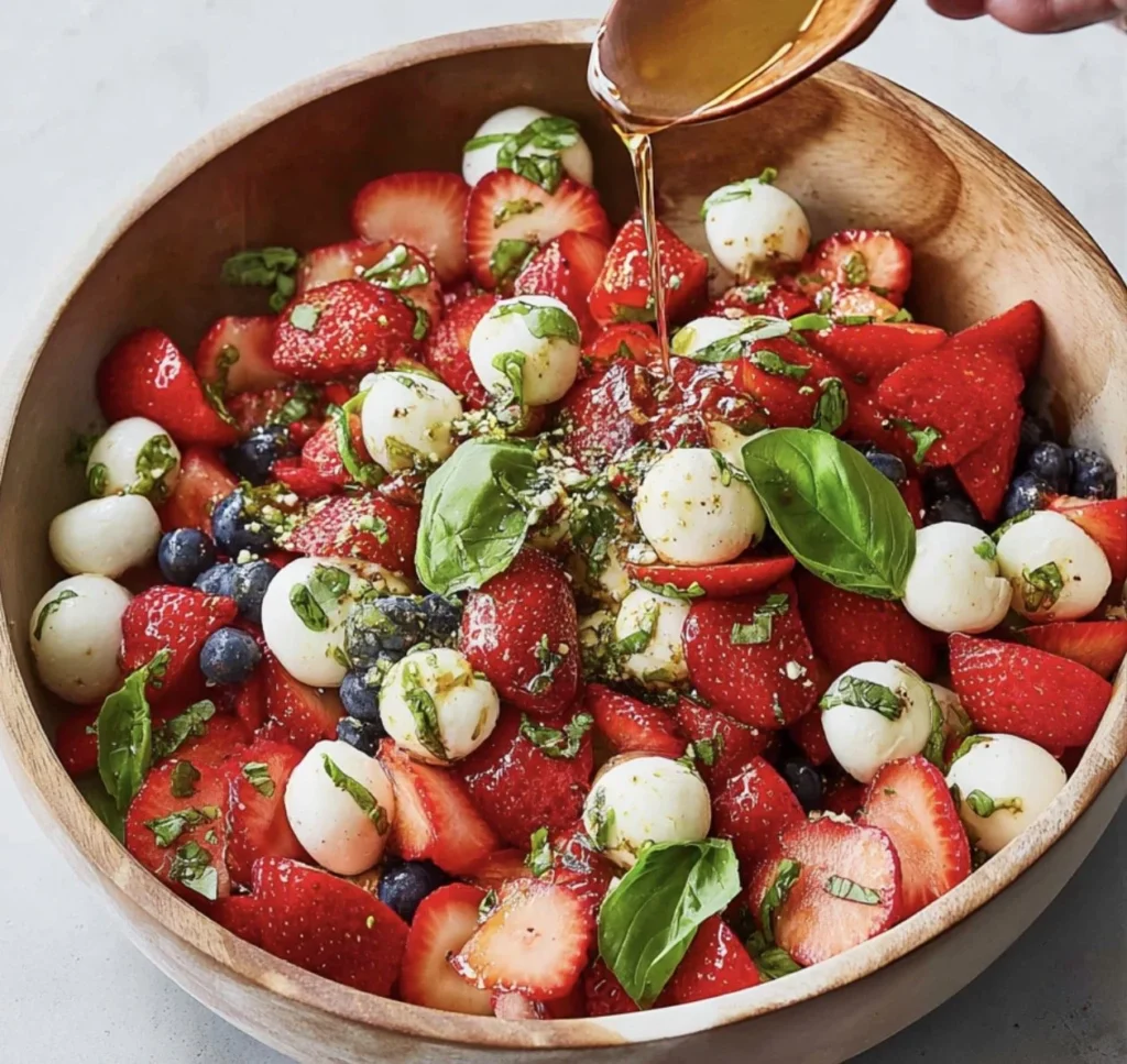 Fresh Strawberry Caprese Salad with mozzarella and basil on a plate