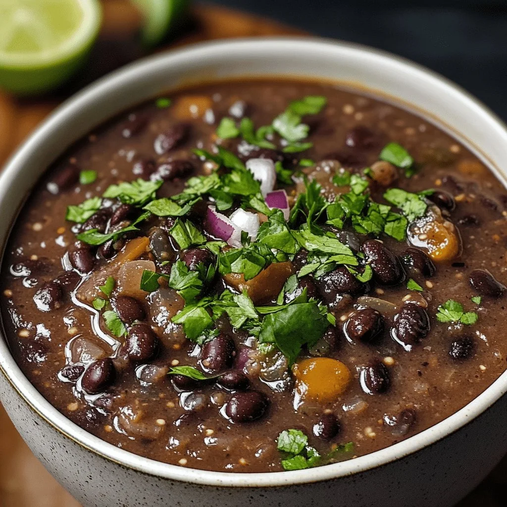 Bowl of hearty black bean soup garnished with herbs and spices