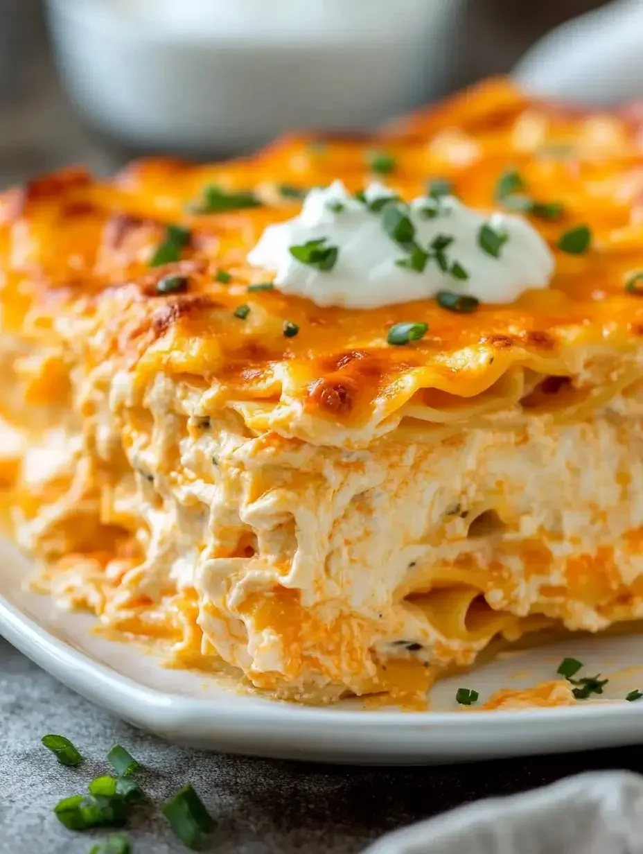 Buffalo Chicken Lasagna with melted cheese and spicy chicken filling