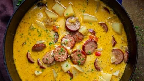 Bowl of delicious Cajun Potato Soup garnished with herbs and spices
