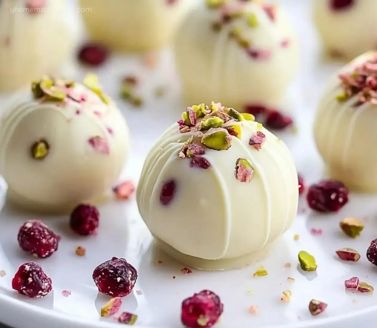 Delicious homemade creamy white chocolate truffles on a decorative plate