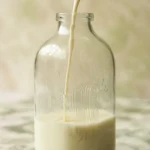 Creamy homemade nut milk made from raw nuts for dairy-free recipes.
