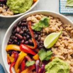 Colorful cauliflower rice bowl with sweet potatoes, veggies, and chickpeas.
