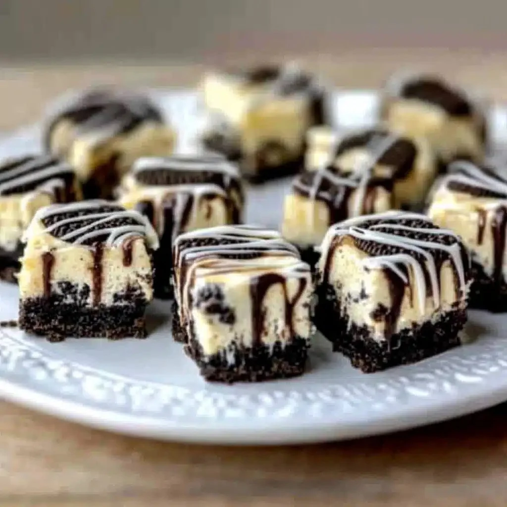 Delicious Oreo cheesecake bites arranged on a plate for a mini dessert treat.