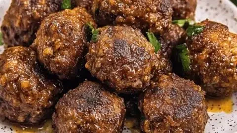 Savory bison meatballs with cranberries and wild rice served on a plate