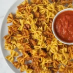 Crispy pasta chips ready for dipping, made in the air fryer or oven.
