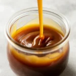 Delicious Vegan caramel sauce drizzled over desserts and coffee in a glass jar.