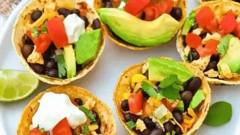 Delicious taco cups filled with black beans and avocado for fun family meals