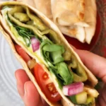 Viral TikTok tortilla wrap hack with various filling options in folded tortillas.