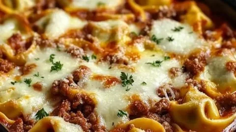 Cheesy Beef Tortellini Bake served in a casserole dish, perfect for cozy dinners.