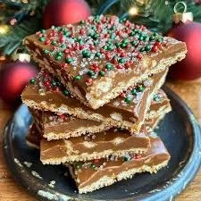 Delicious classic Christmas toffee drizzled with chocolate and sprinkled with nuts.