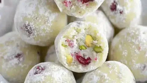 Cranberry Pistachio White Chocolate Truffles on a decorative plate