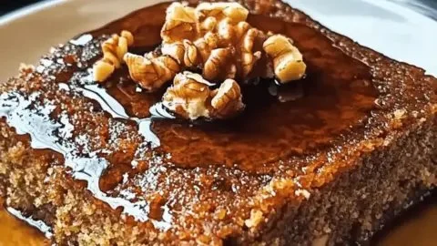 Delicious Greek Walnut Cake (Karithopita) topped with walnuts and syrup