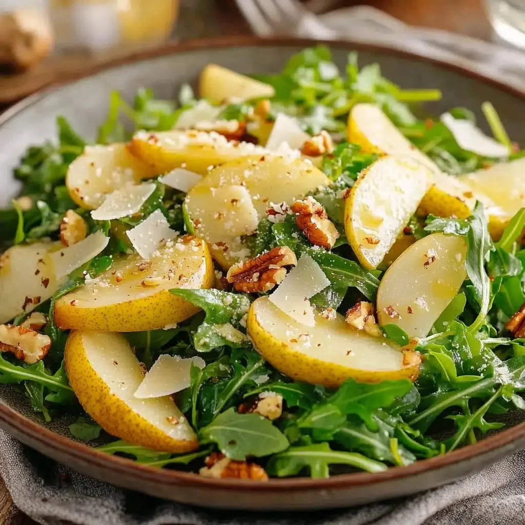 Elegant pear and rocket salad with parmesan cheese and walnuts
