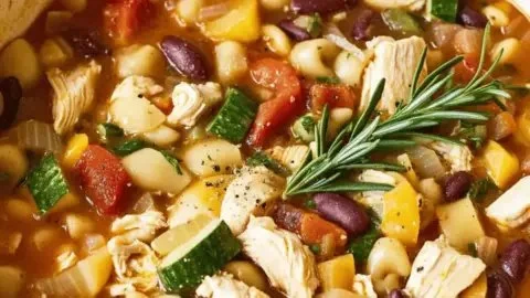 Bowl of hearty chicken minestrone soup with vegetables and noodles