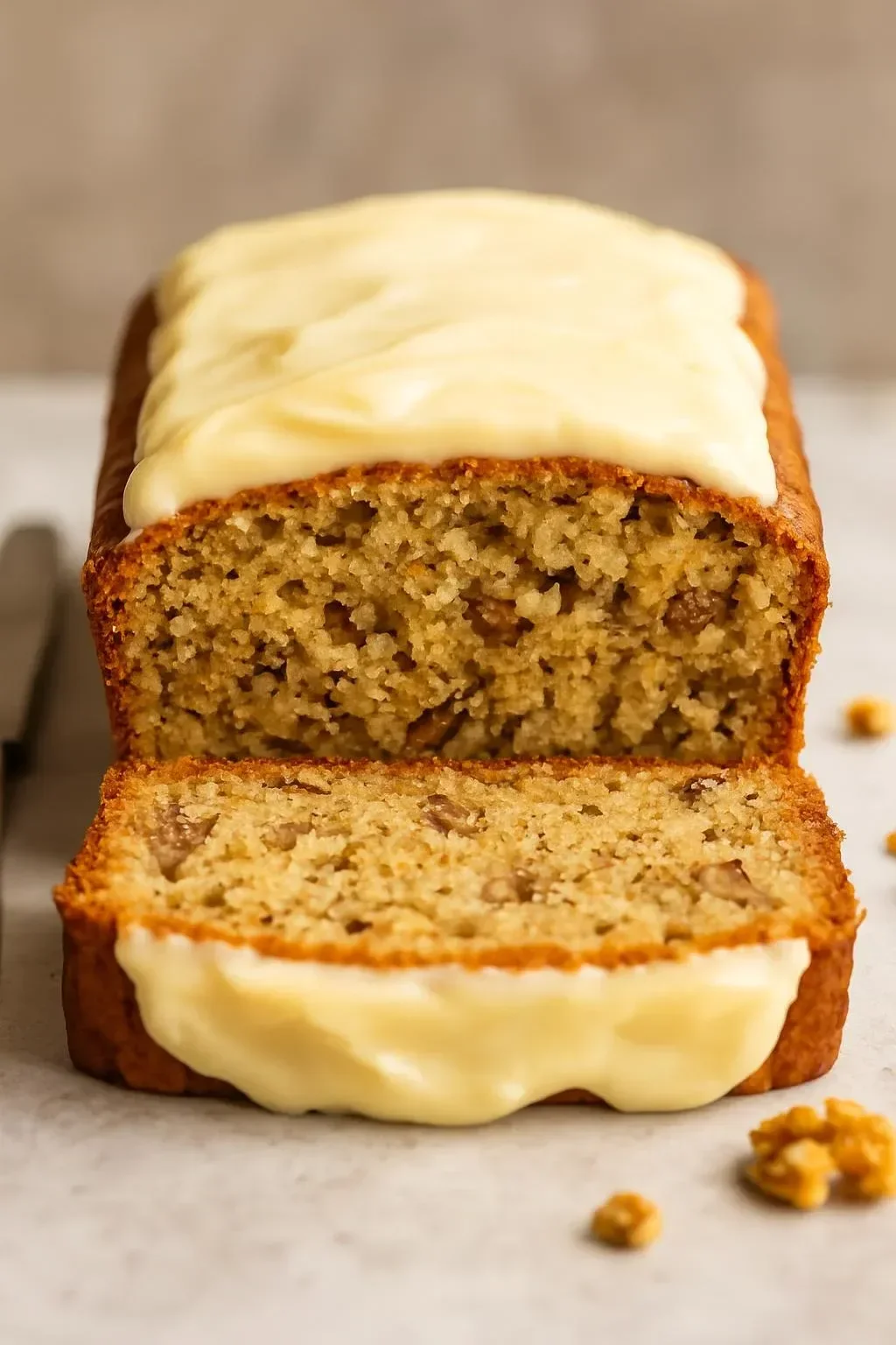 Heavenly carrot cake loaf with cream cheese filling on a rustic wooden table